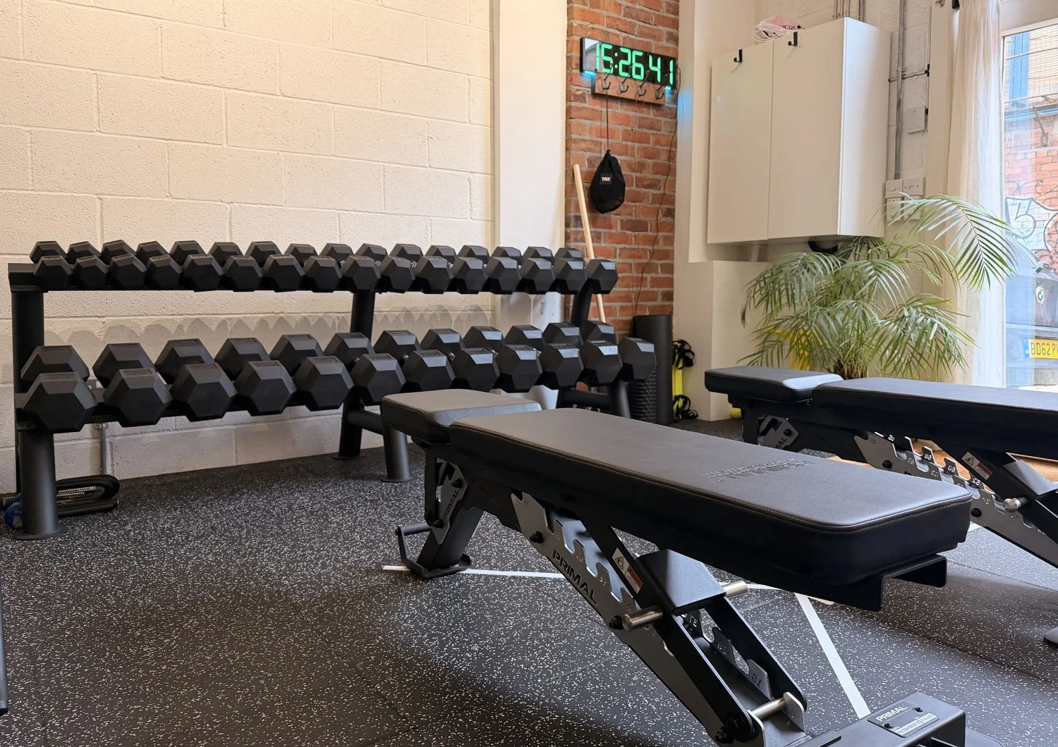 Dumbbell weight set and benches in the clinic gym