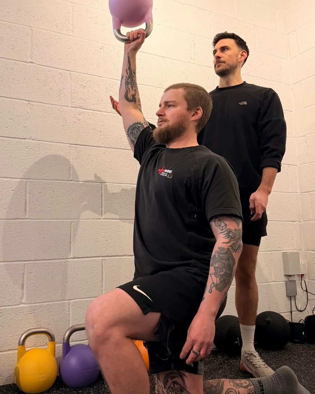 Kettlebell press during a conditioning session