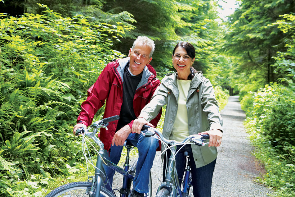 Couple cycling - Amplify Hearing Downend lifestyle hero / schema image