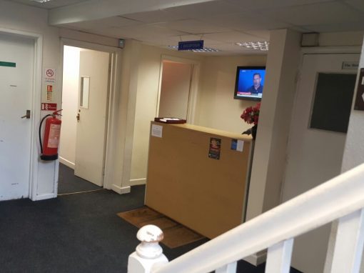 Building corridor and reception desk on the first floor of Monarch House