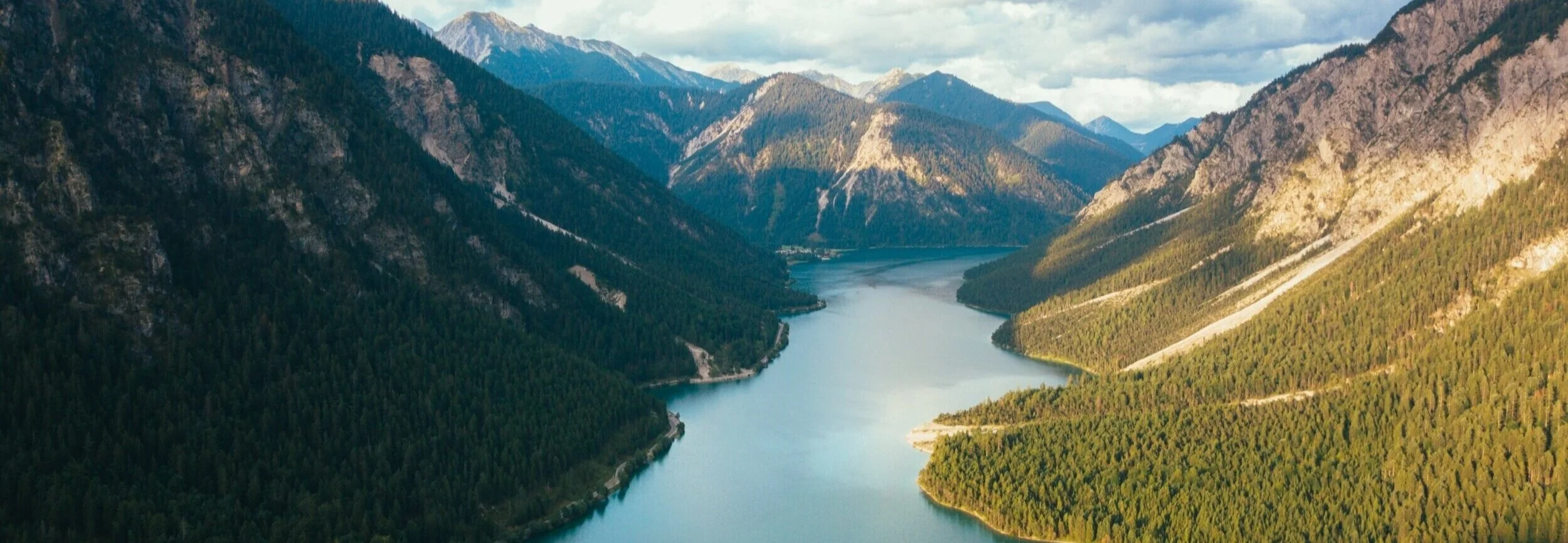 About page banner image (mountain lake landscape)
