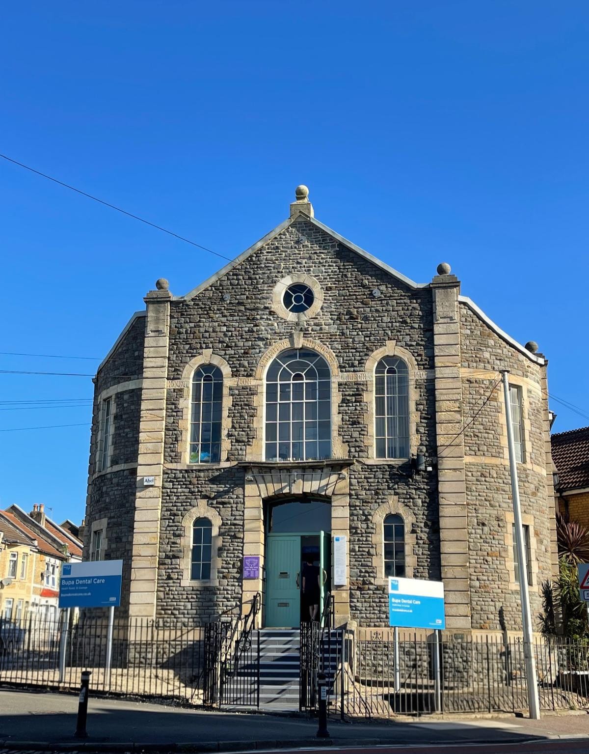 Front exterior of Bupa Dental Care St George, a converted stone church on Neath Road