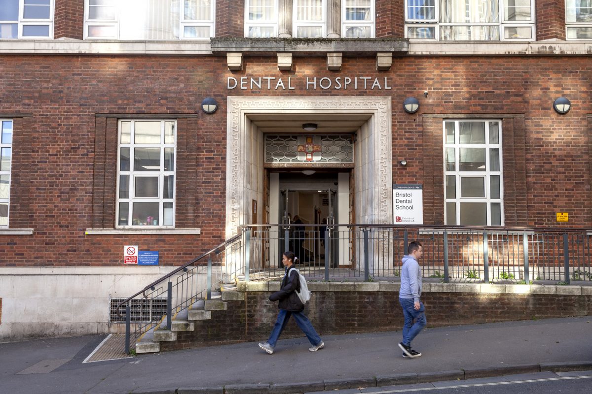 Bristol Dental Hospital street entrance on Lower Maudlin Street, brick facade reading 'Dental Hospital'