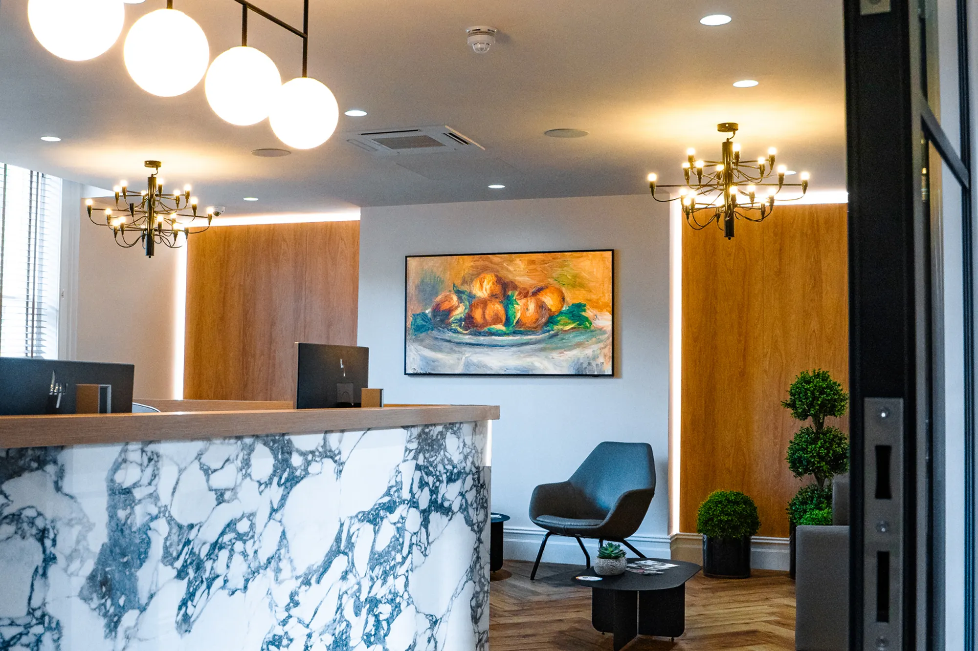 Clarendon Dental Spa reception area with marble desk and ambient lighting