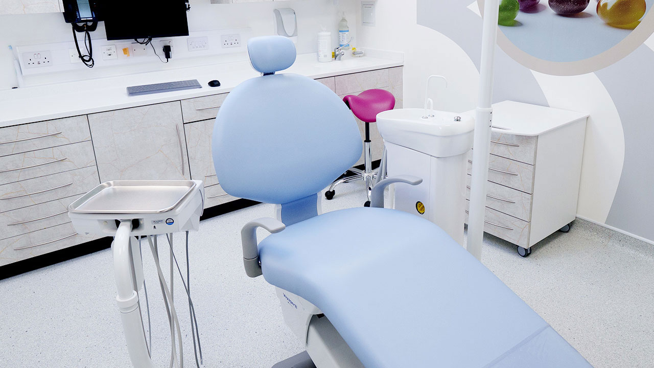 Dental treatment room with mydentist-branded chair and surgery equipment