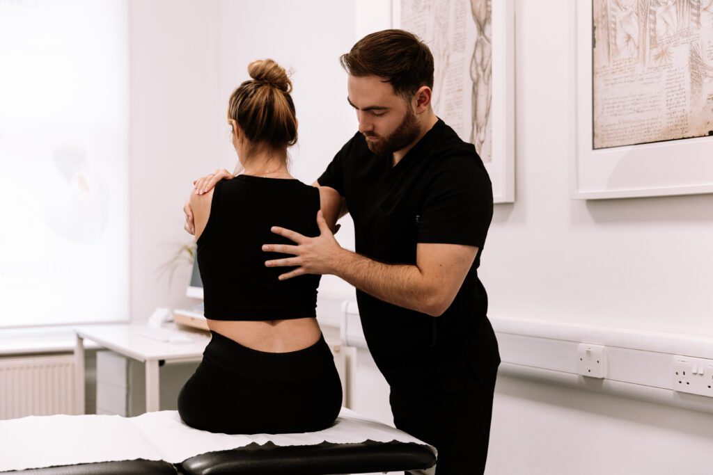 Chiropractor performing treatment at clinic