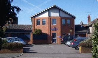 Exterior of Grange Road Surgery building and car park