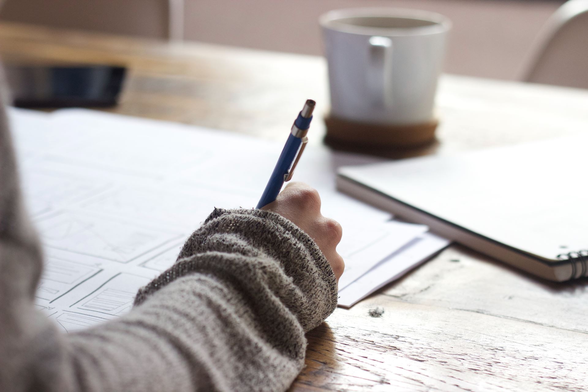 writing on paper (homepage Sick Notes card, generic stock photo)