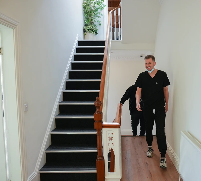 Leeds Wellness Dental team members on stairs