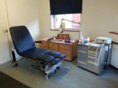 Dursley surgery treatment room with podiatry chair and equipment