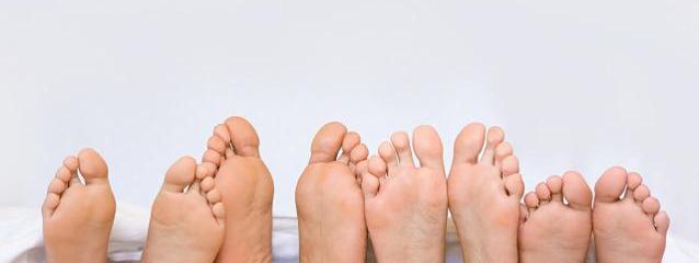 Site hero banner showing a row of bare feet
