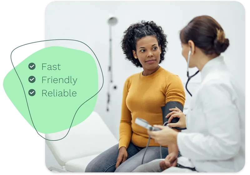 Doctor consulting with patient, taking blood pressure