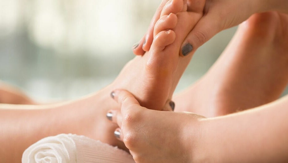 Close-up of a reflexology foot massage treatment