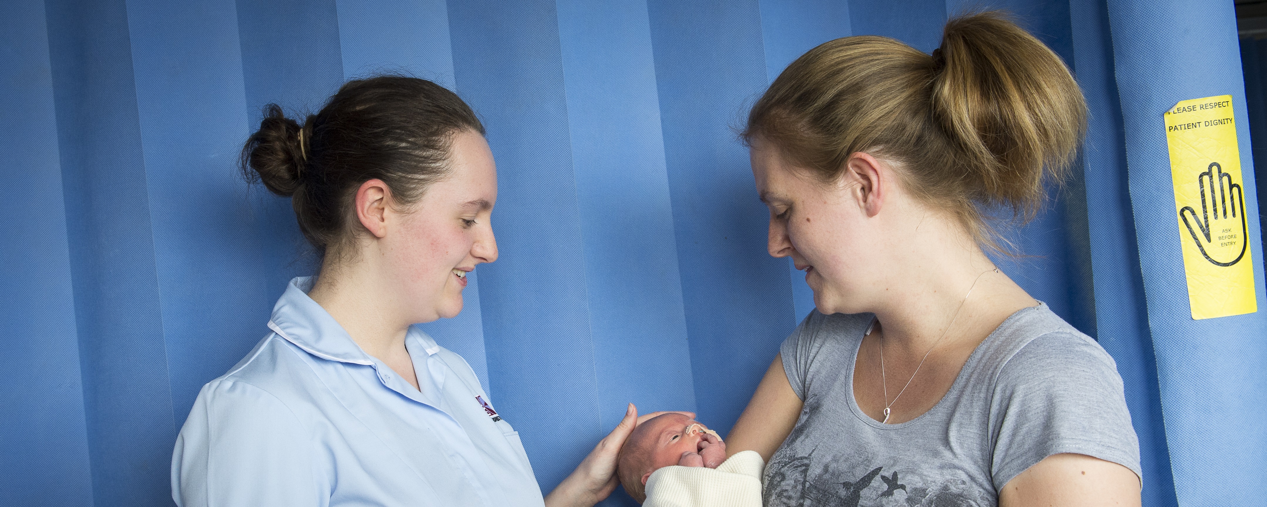 UHBW banner photo of a student children's nurse with a mother and baby (generic trust banner)