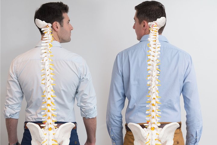 Directors Charles Herbert and Matt Poulter photographed with spine models