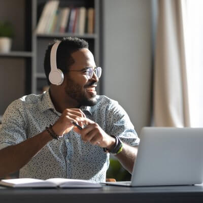 Man at desk wearing headphones